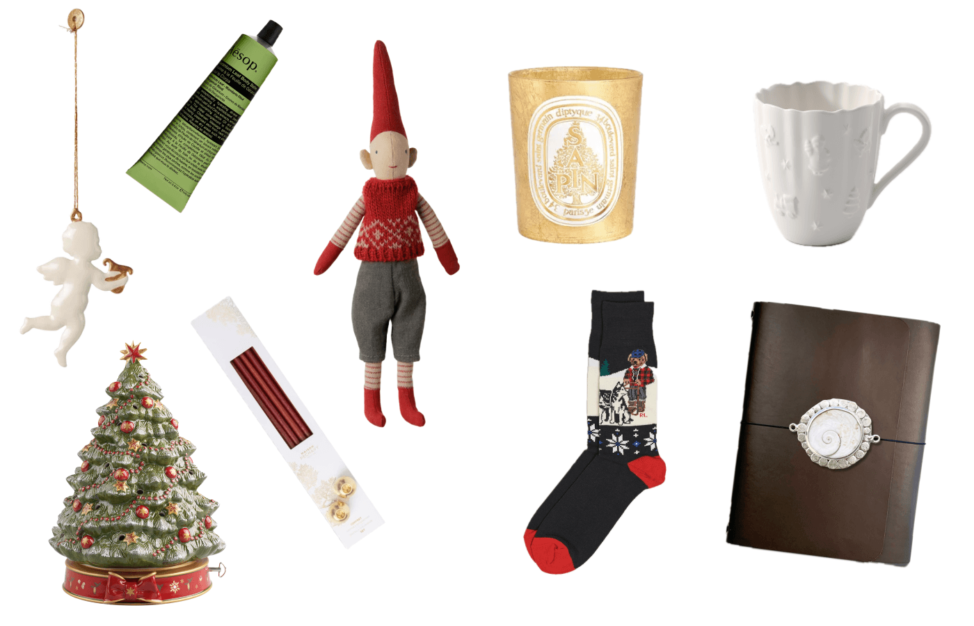 Small Christmas luxuries laid out on white: a body balm, a gold candle, a white mug, a Christmas tree music box, red candles, festive socks, a leather notebook and a doll in a red hat